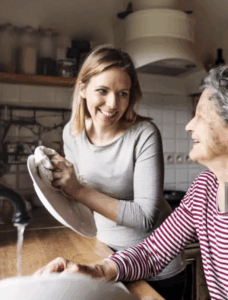 Kind carer assisting older woman with evening routine at home in Christchurch