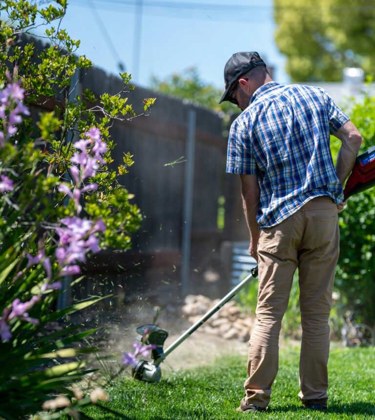 Carer weeding garden beds – gardening services Christchurch and Tauranga