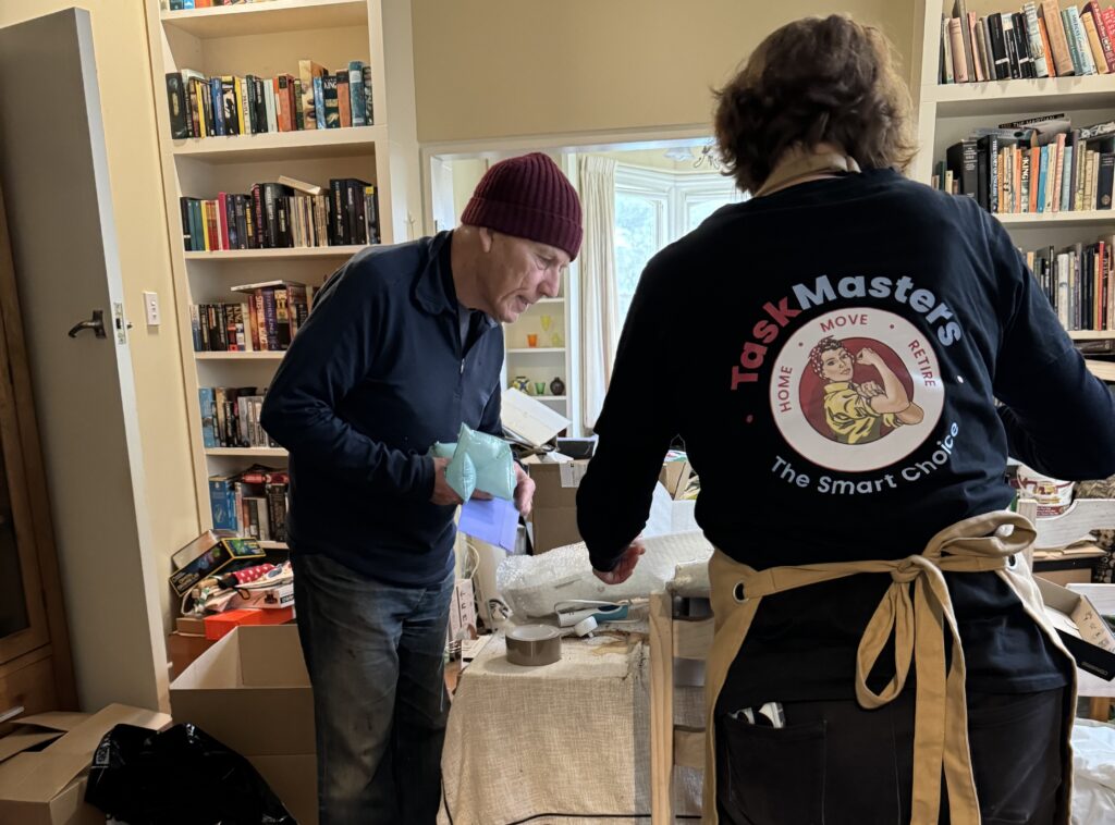 TaskMasters team member assisting an older man with home organising in Tauranga and Christchurch